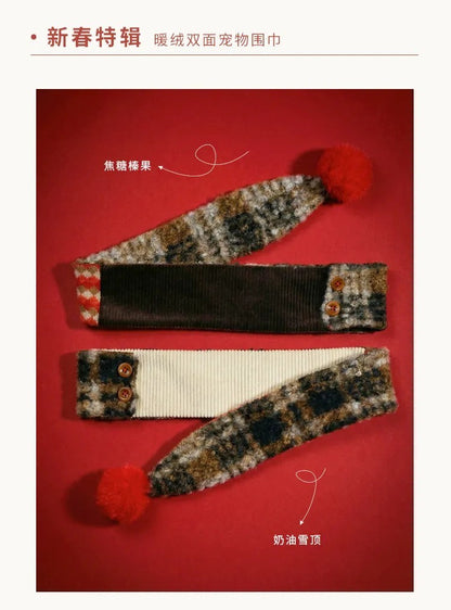 Christmas pet scarf flat lay with red pom pom